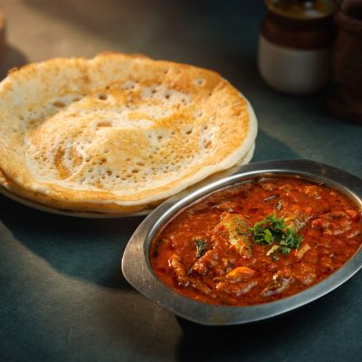 Kal dosa with fish kuzhambu